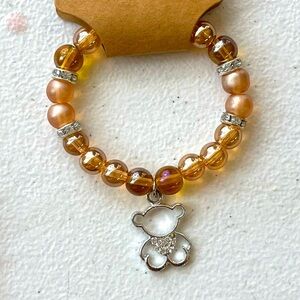 Brown bracelet with charm